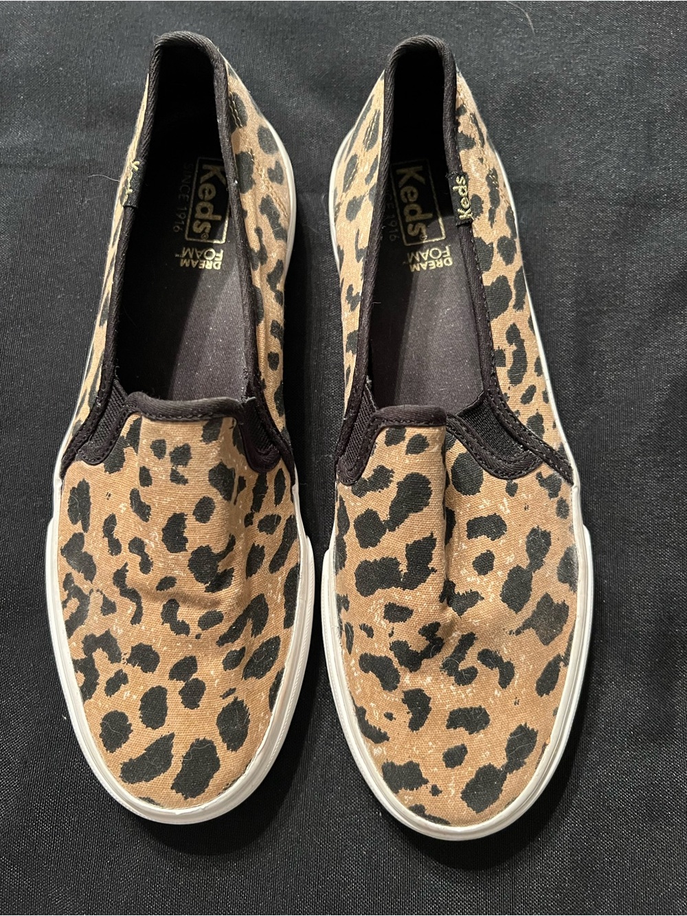 Keds Leopard Print Slip-On Sneakers in Brown and Black